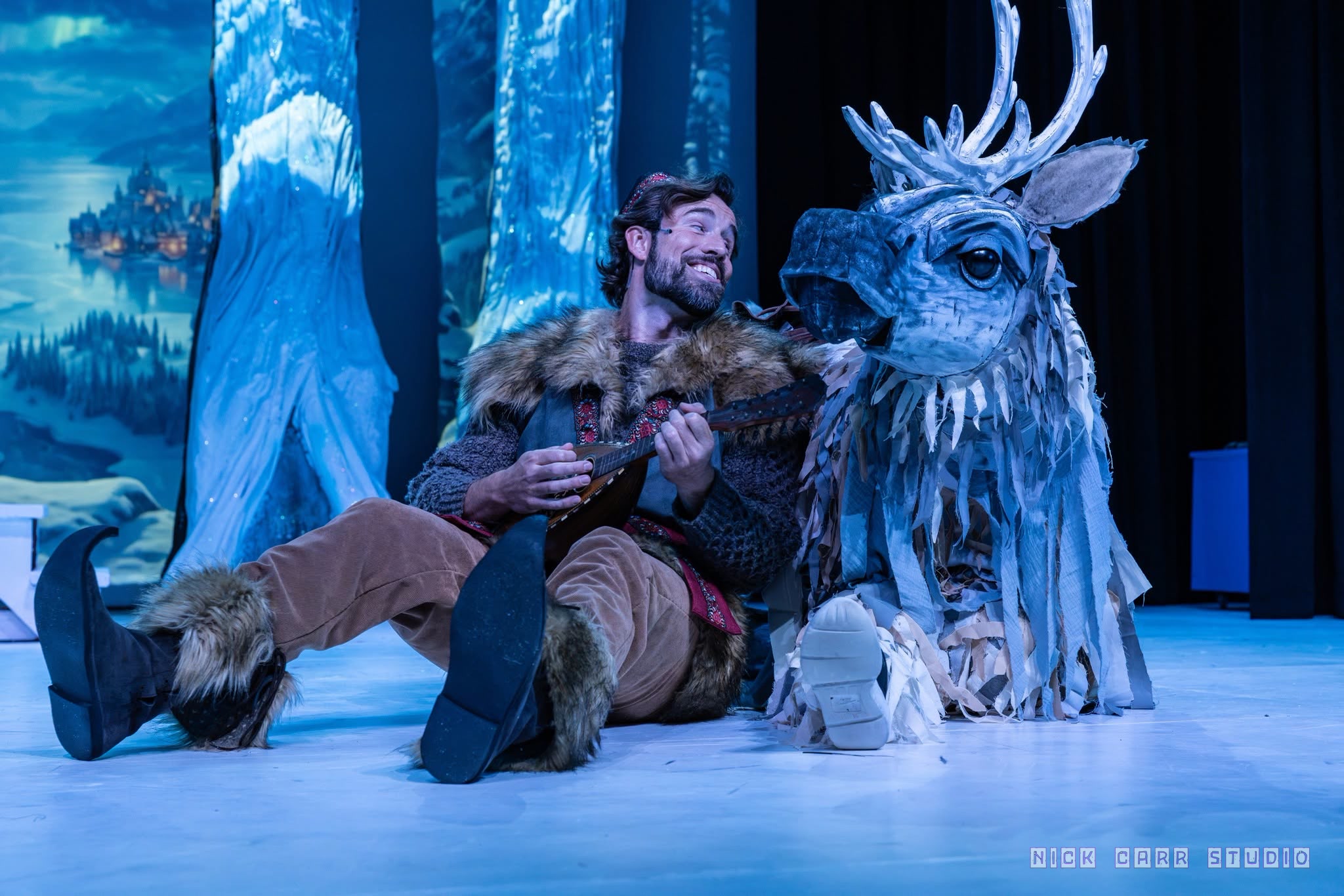 Kristoff seated beside Sven in Disney's Frozen