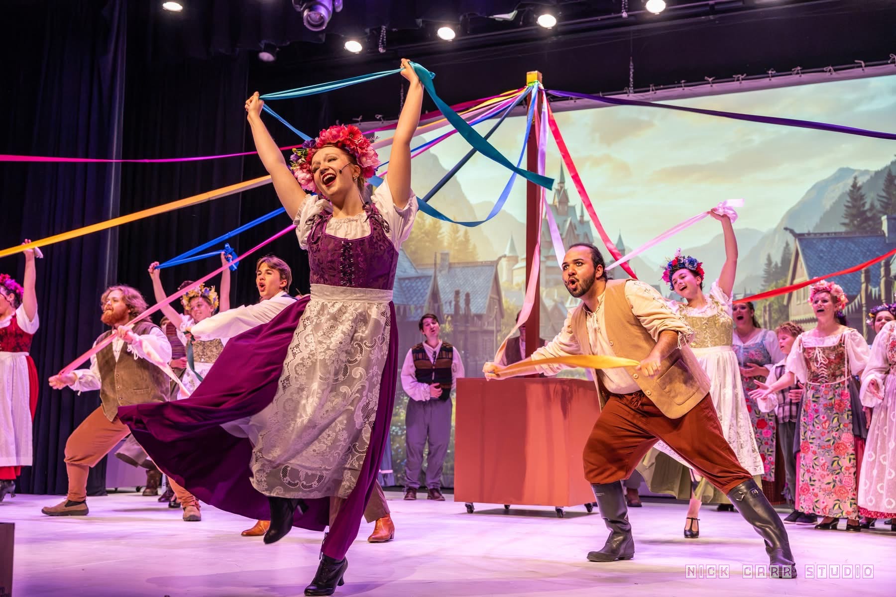 Frozen ensemble celebrating with colorful ribbons